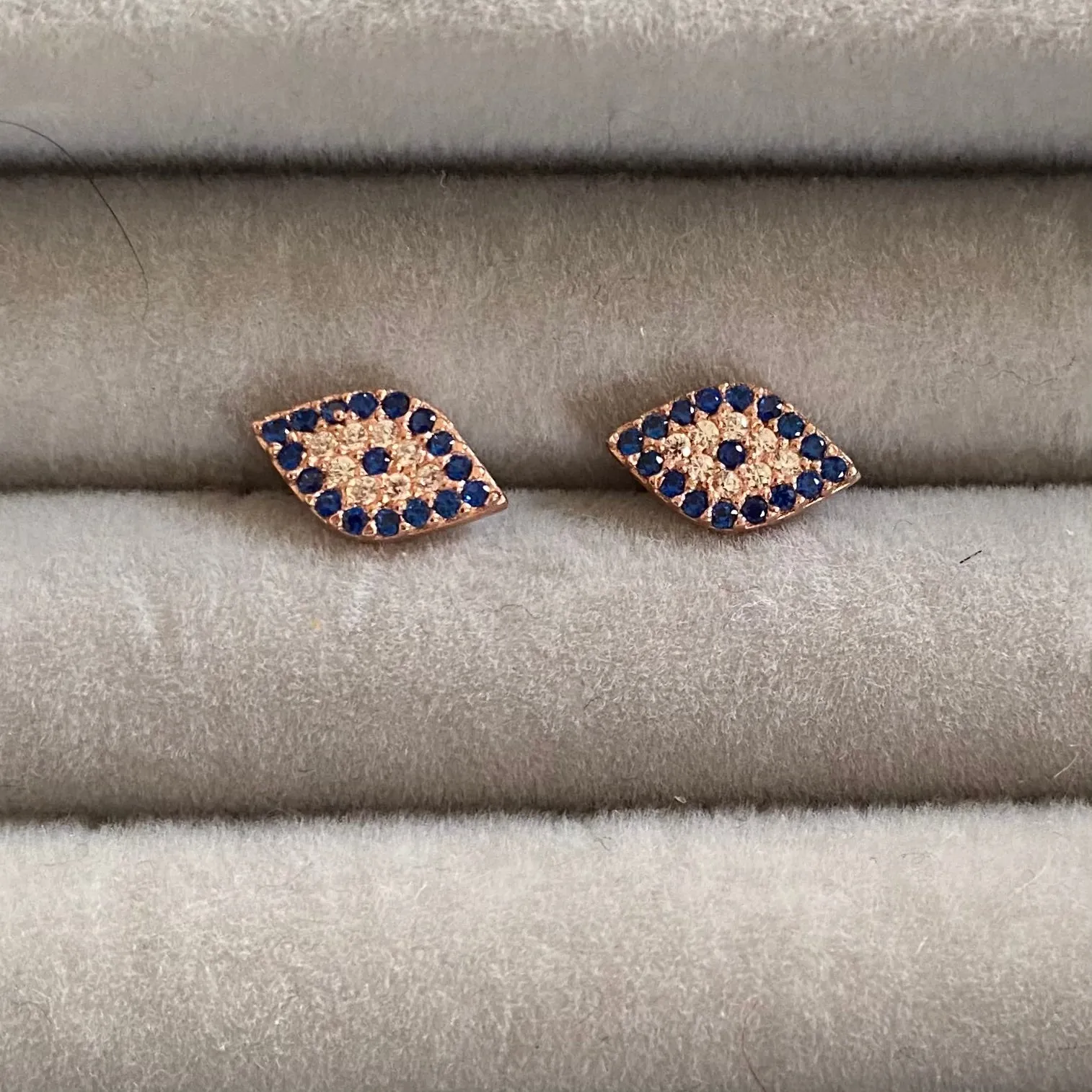 Evil eye studs with dark blue and clear stones