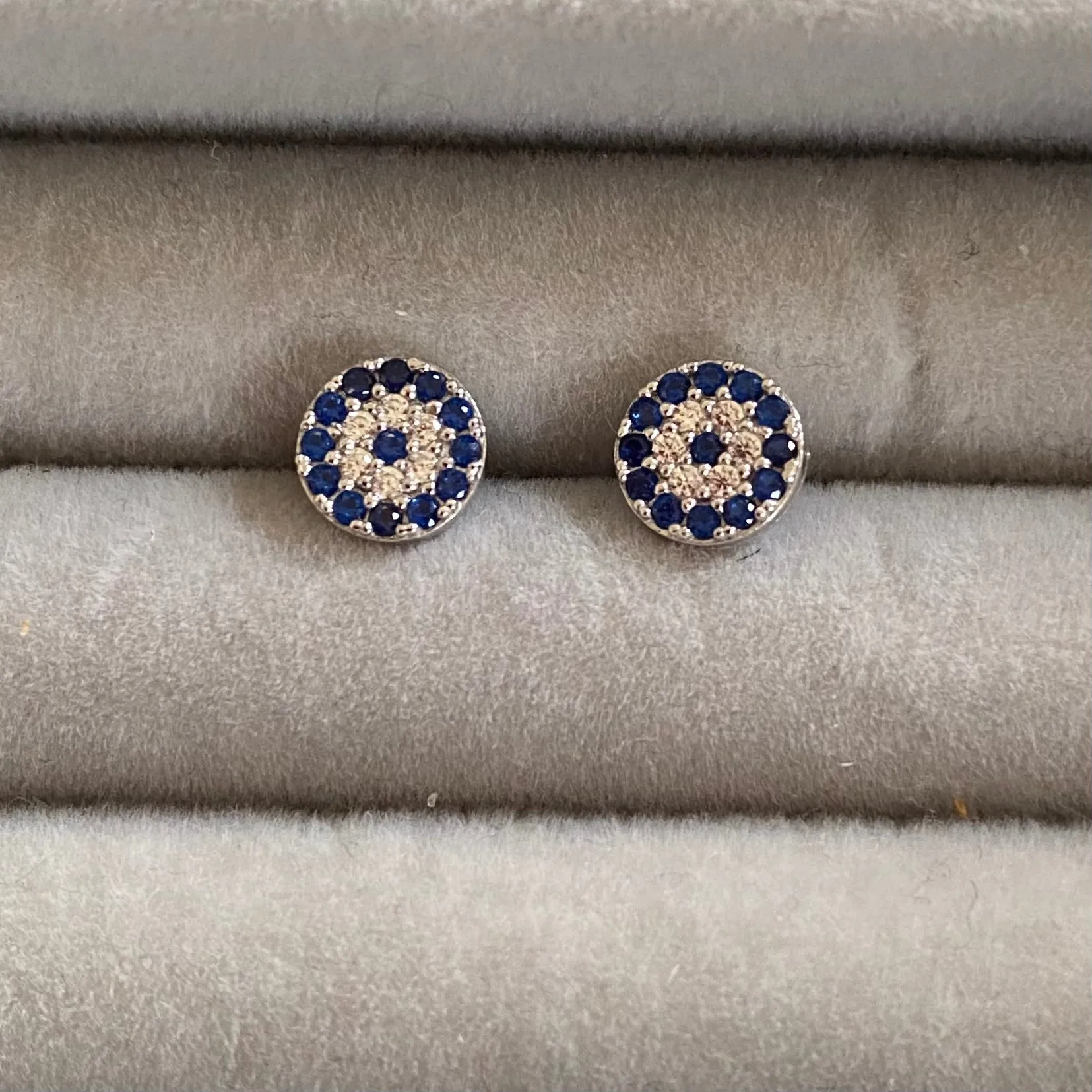 Evil eye studs with dark blue and clear stones