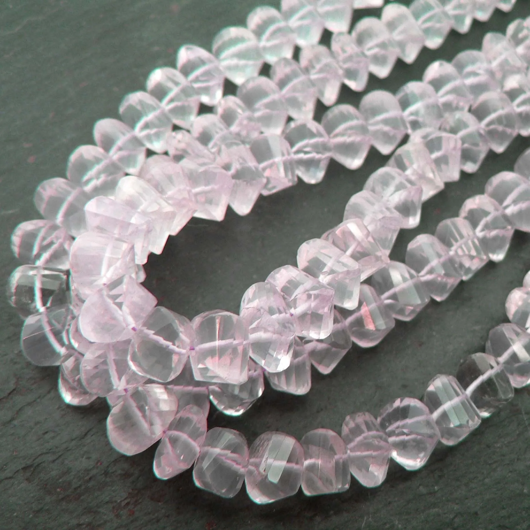 Rose Quartz Twist Faceted Rondelles A Grade 9" Strand